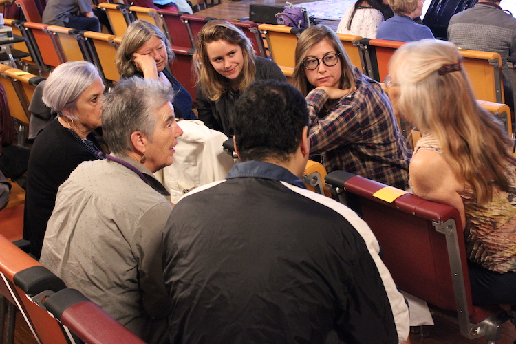 Small group of OLLI members and Cal undergrads in conversation